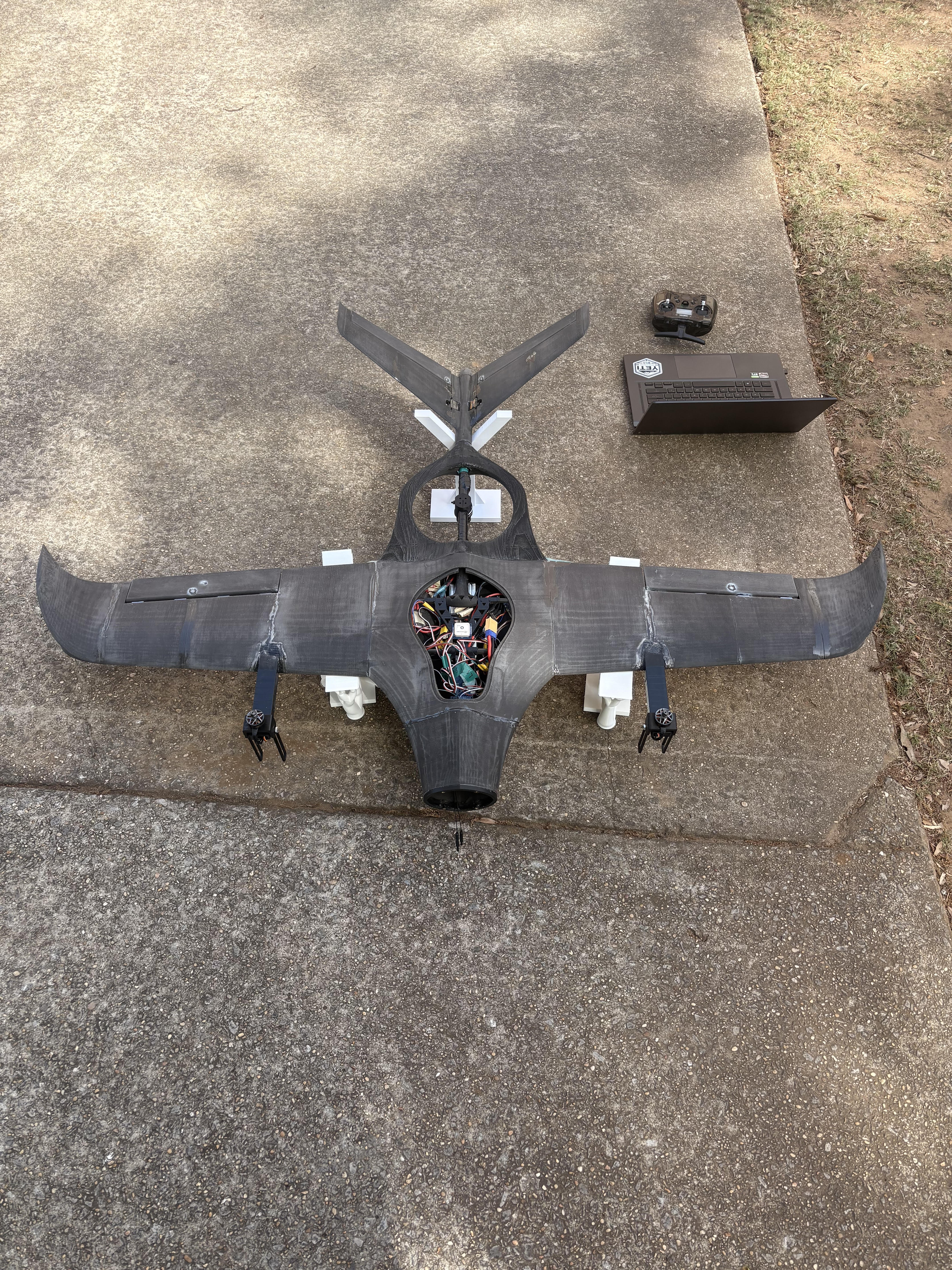 Founder's 3D-printed fixed-frame VTOL aircraft — airframe, custom electronics, and flight firmware